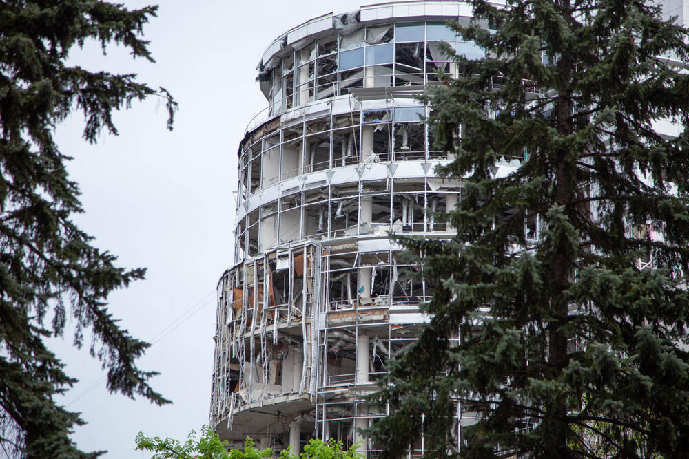 A damaged building with missing windows