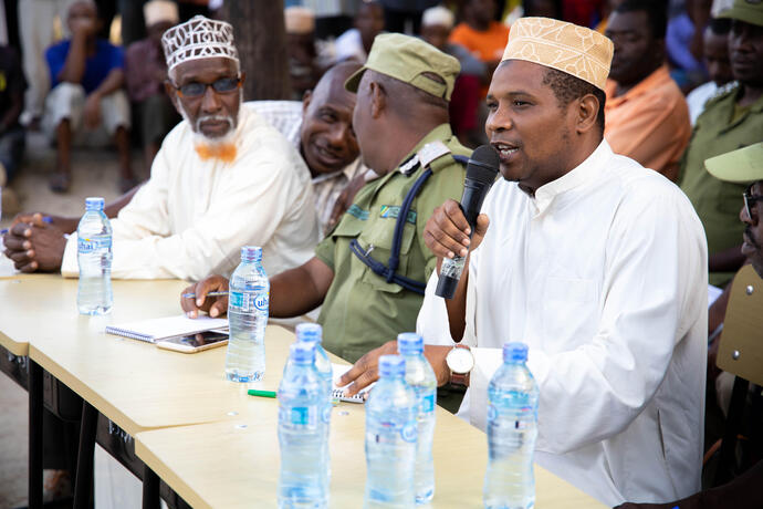 Man speaking using a microphone. 