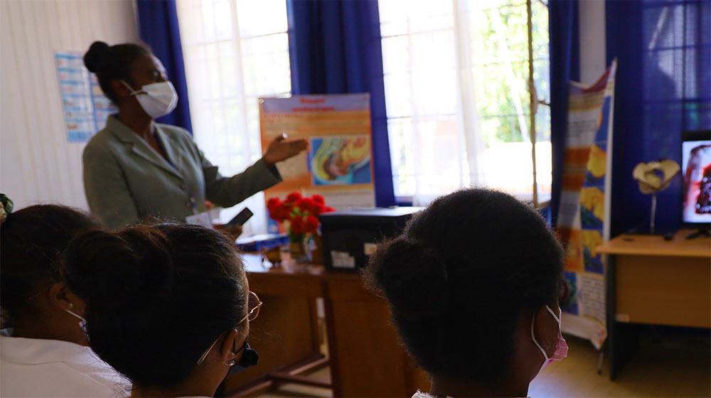 Students in classroom watch instructional video