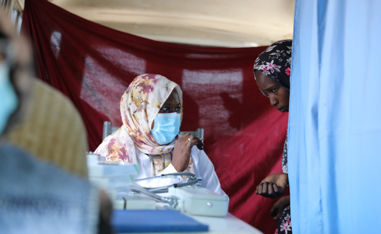  A woman visits a mobile health clinic.