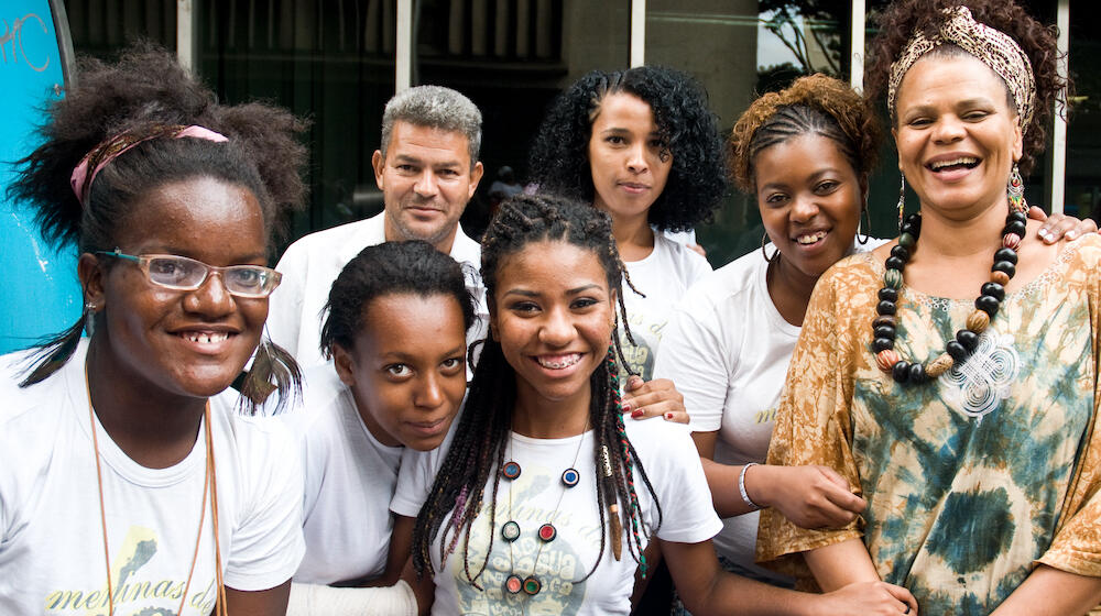 A group of people are smiling. 