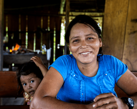 A woman and her young daughter in their home.