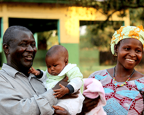 A mother and father with their baby.