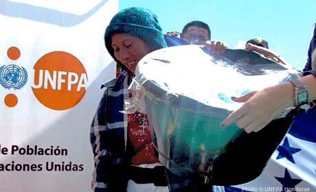 A women carrying container