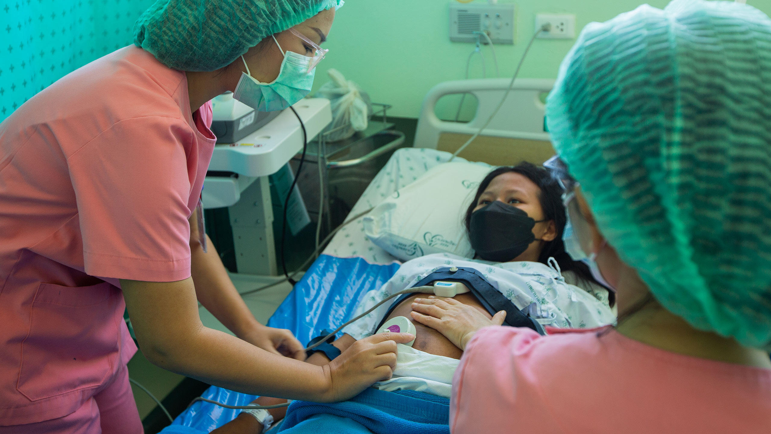 Demand for sexual and reproductive health services continued, even as supply chains were disrupted and health systems stretched. Midwives in a maternity ward in Thailand monitor a pregnant woman for potential complications.