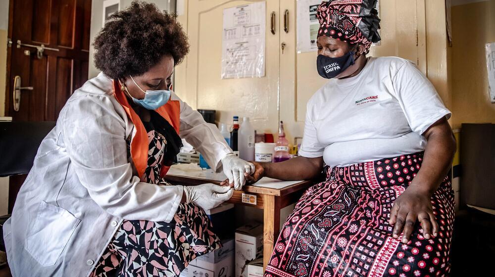 A medical worker performs a blood test.