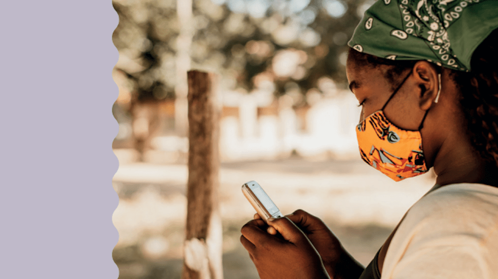 A young girls uses a mobile phone. 